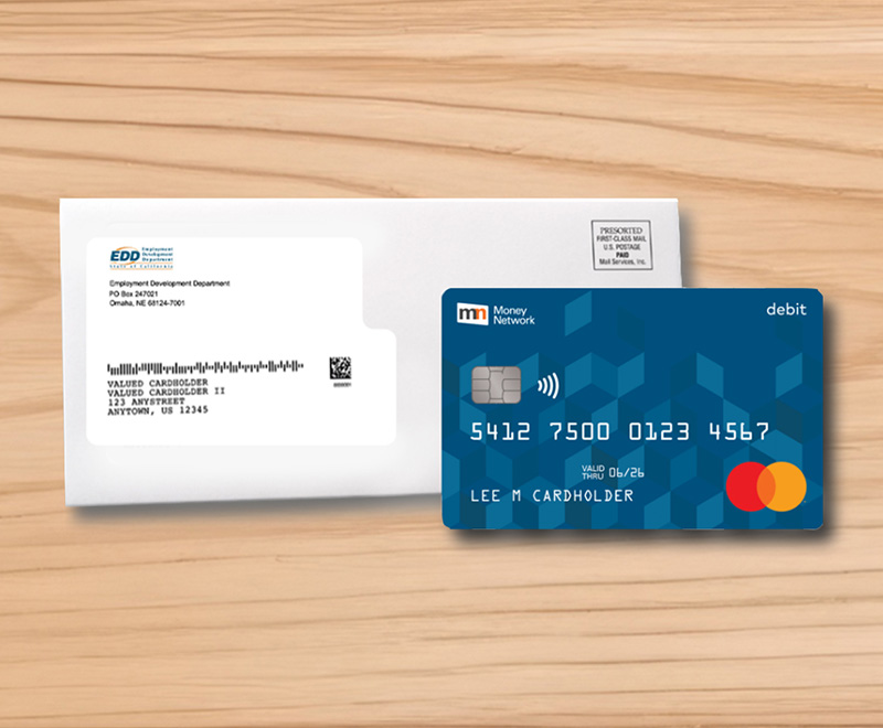 blue credit card and white envelope set on table