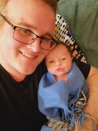 Father holding his newborn baby