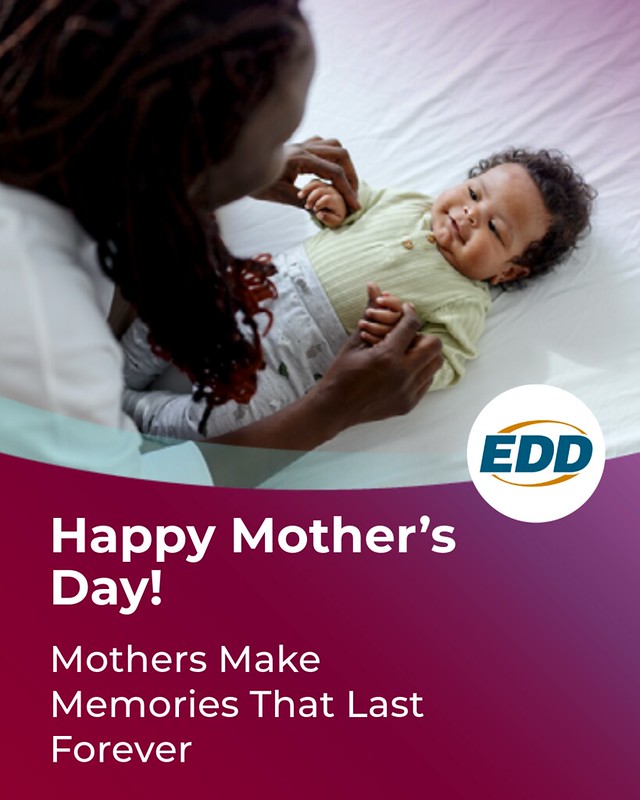 A mother playing with her baby lying on its back. Under the photo is the EDD logo and a slogan reading “Happy Mother’s Day! Mothers Make Memories that Last Forever.”